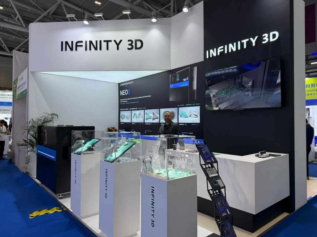An Infinity 3D representative at the company's exhibition stand with printed pattern displays