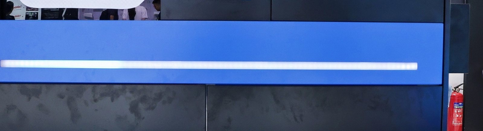 Close-up of the Uniway NEO3 printer's illuminated blue front panel